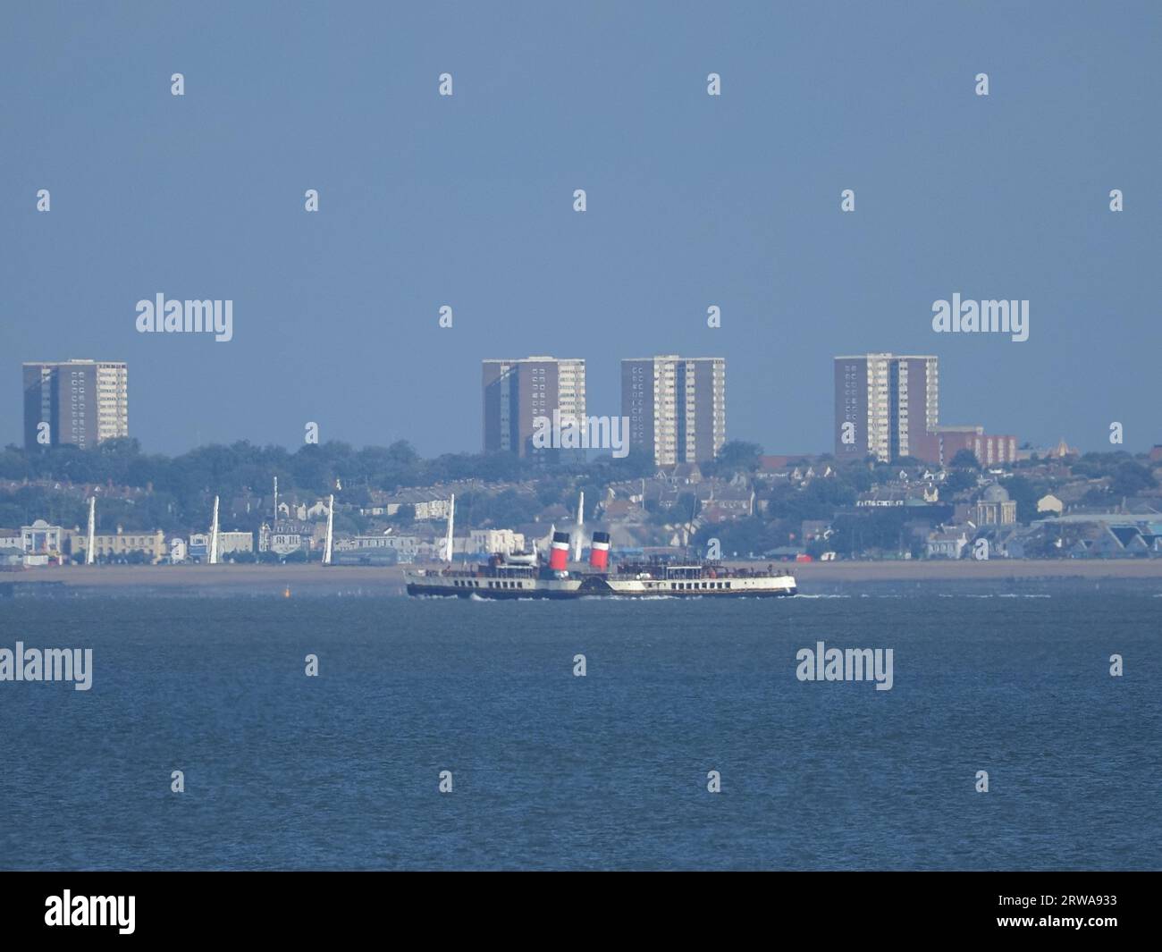 Sheerness, Kent, UK. 18th Sep, 2023. The historic Waverley paddlesteamer seen passing Sheerness, Kent as she arrives on the Thames. Due to strong winds she's berthing at Gravesend until her first official Thames estuary trip on Friday. Pic: passing Southend on Sea in the background. James Bell/Alamy Live News Stock Photo