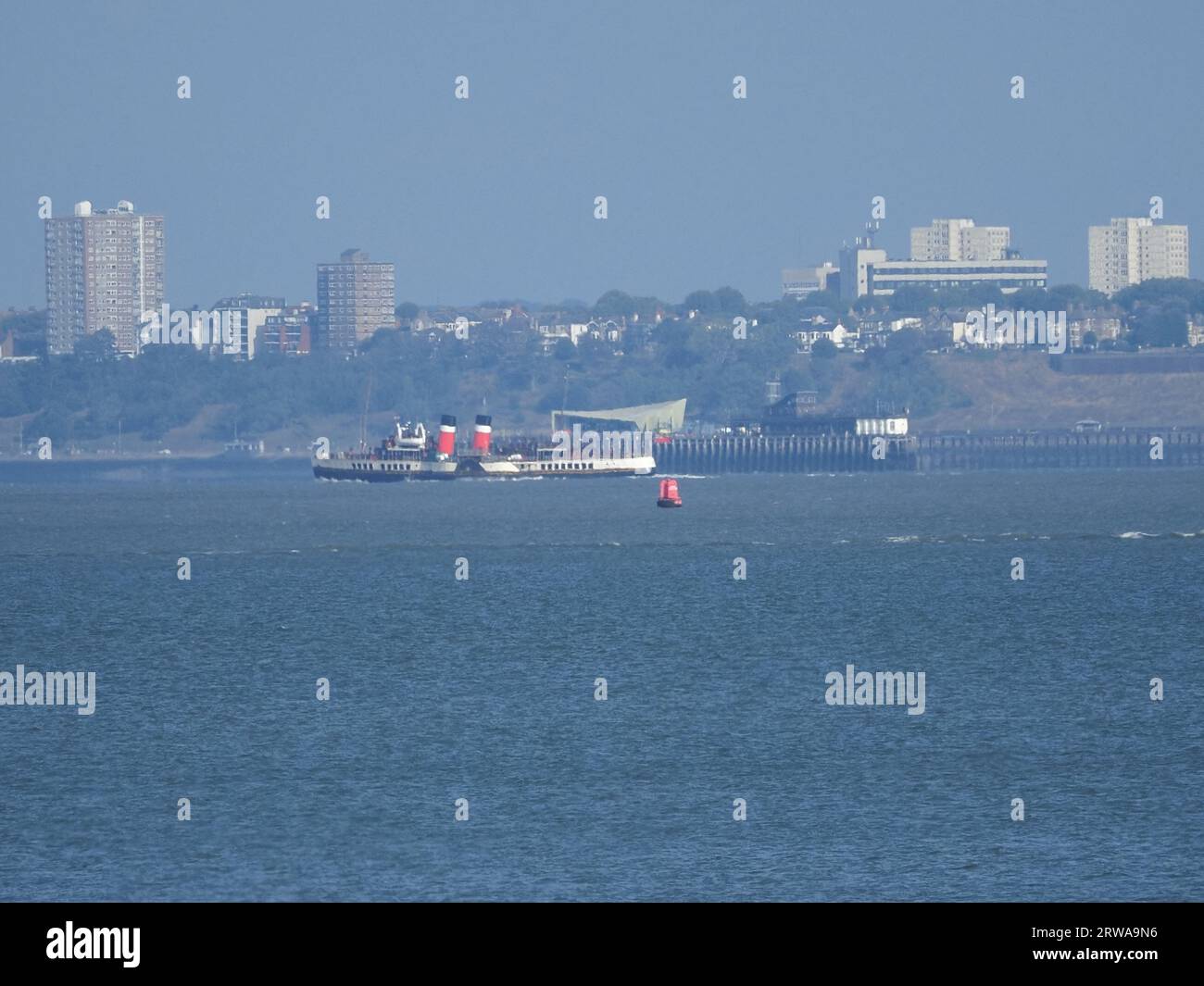 Sheerness, Kent, UK. 18th Sep, 2023. The historic Waverley paddlesteamer seen passing Sheerness, Kent as she arrives on the Thames. Due to strong winds she's berthing at Gravesend until her first official Thames estuary trip on Friday. Pic: passing Southend on Sea pier head in the background. James Bell/Alamy Live News Stock Photo