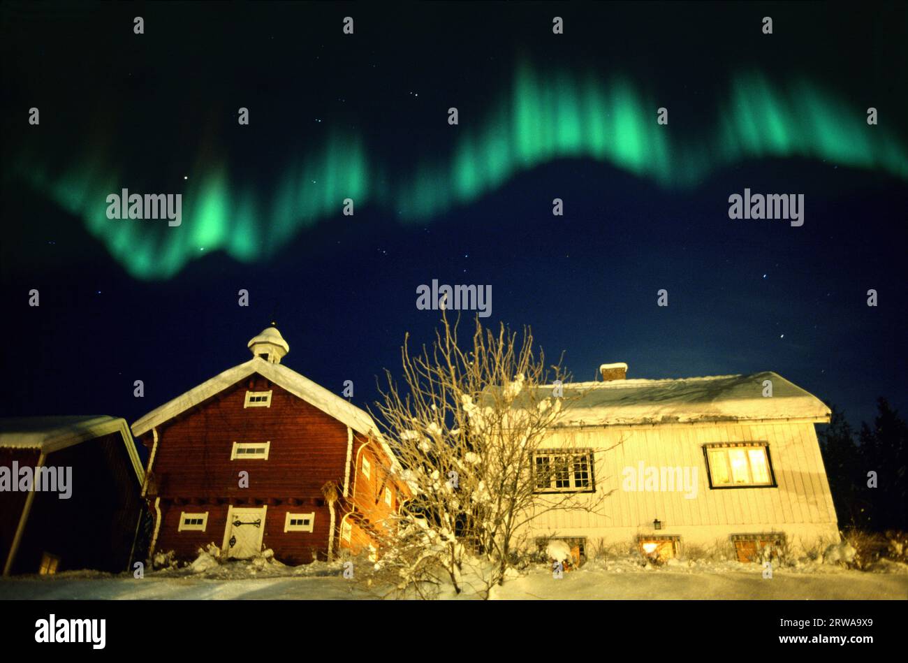 Aurora borealis over traditional house Stock Photo - Alamy