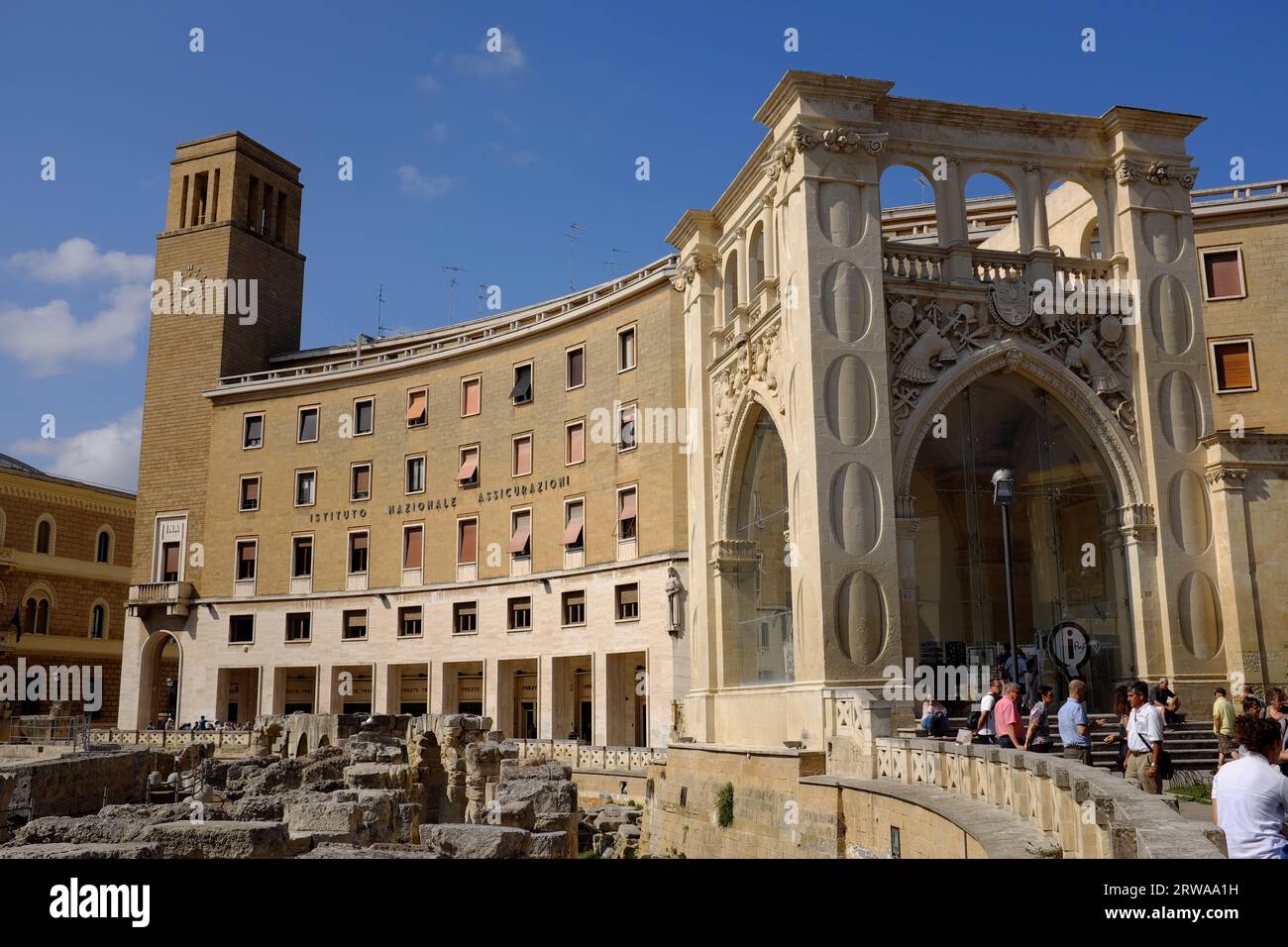 Sant Oronzo Square with Roman Amphitheatre and the INA palace.. Lecce Italy. Stock Photo
