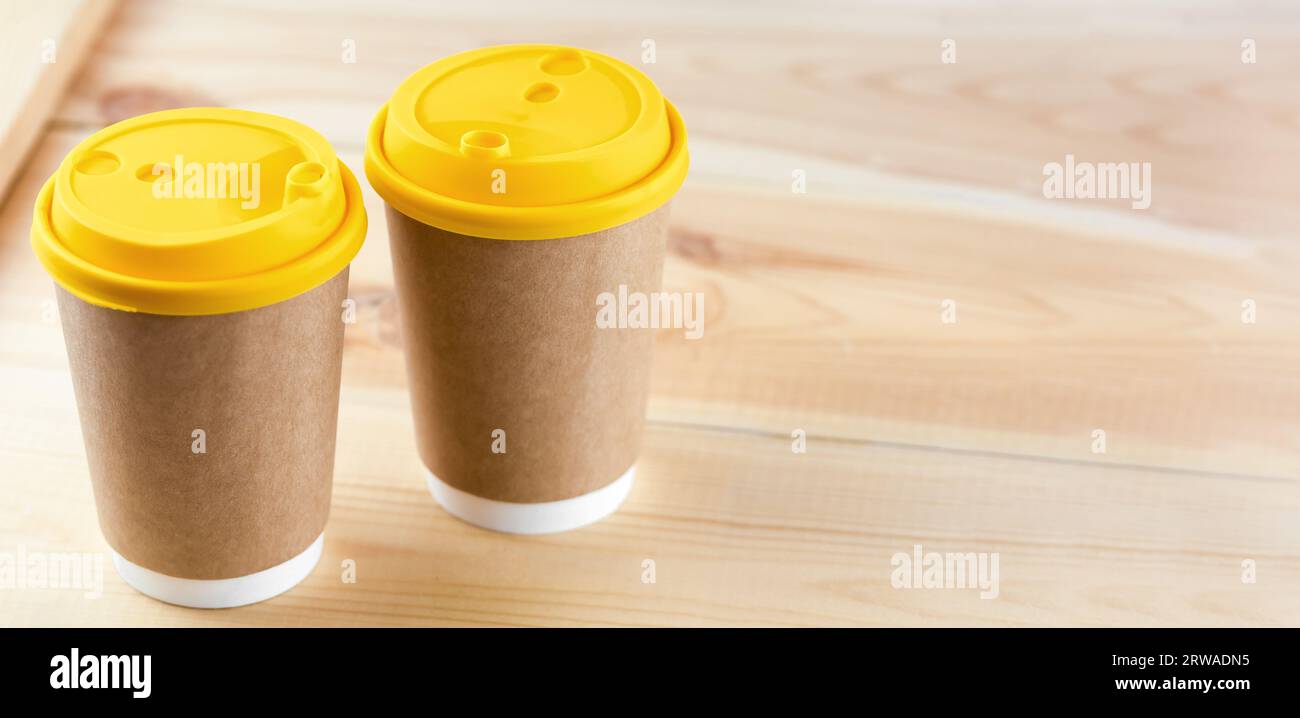 Two Disposable Coffee Cups on table top with copy space. Stock Photo