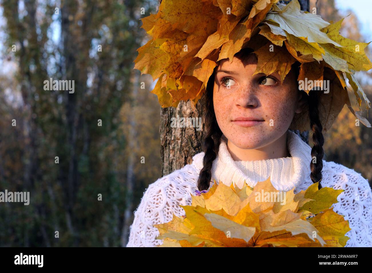 portrait of freckled teenage girl in the autumn park at the evening Stock Photo
