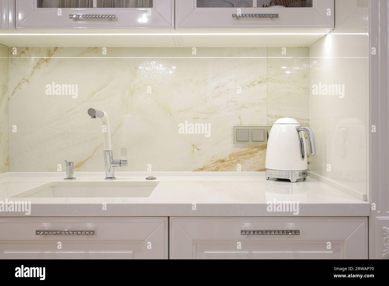 Faucet with granite sink in the kitchen Stock Photo Alamy