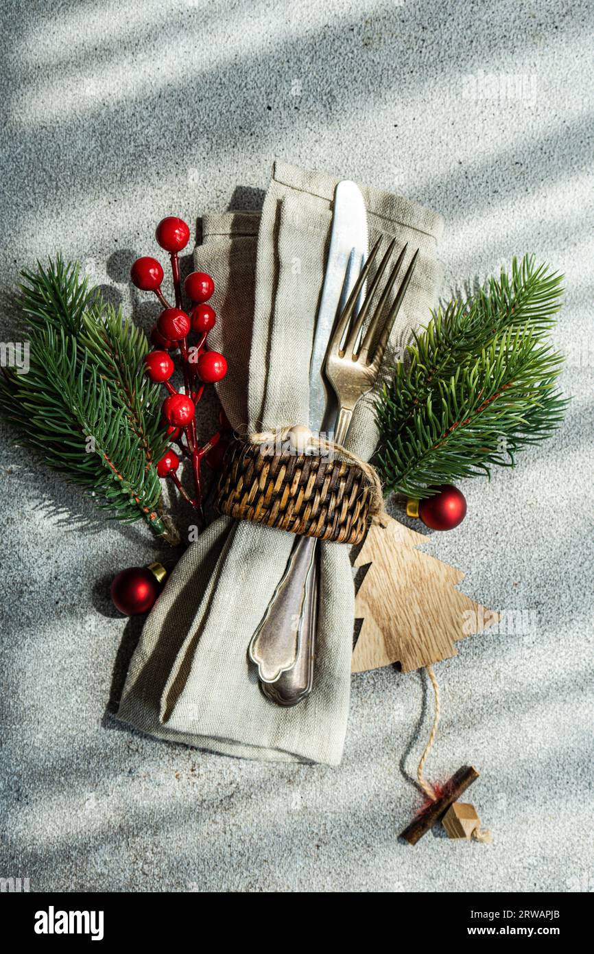 Holiday Christmas dinner place setting on grey concrete background Stock Photo