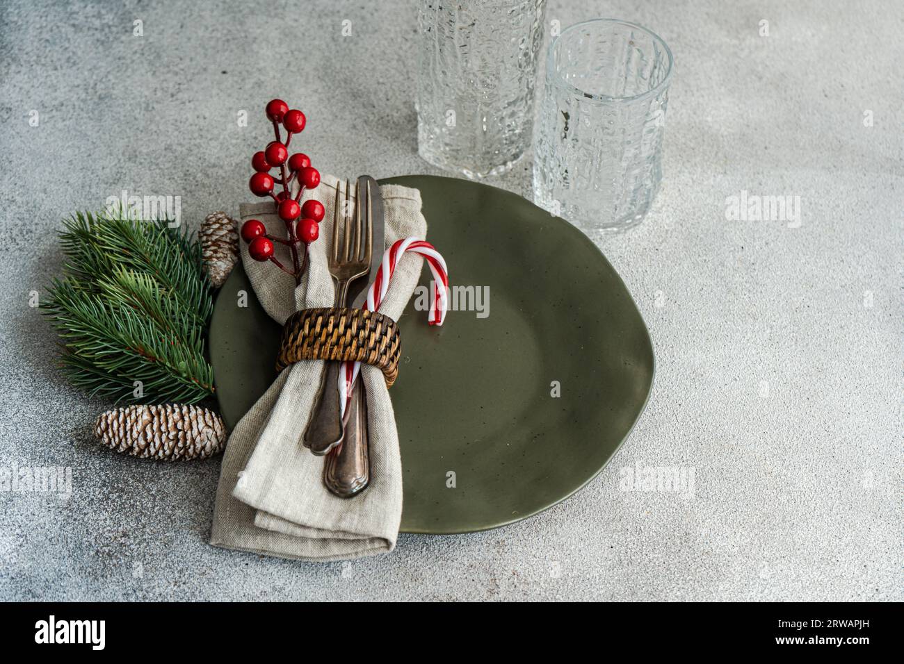 Overhead view of a festive Christmas place setting on a table Stock Photo