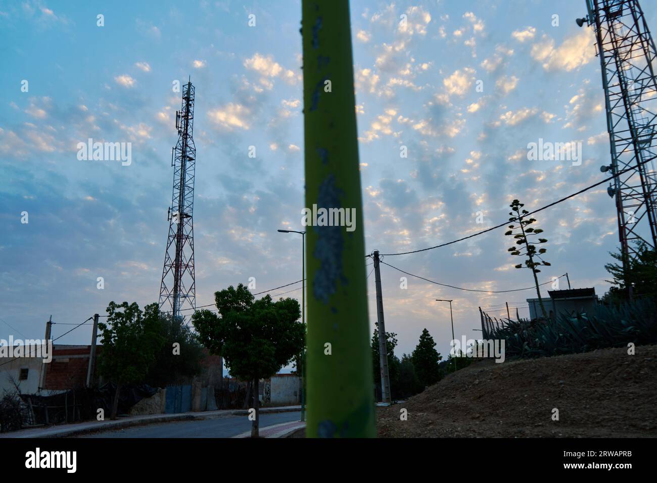 power lines in the field at sunset Stock Photo - Alamy