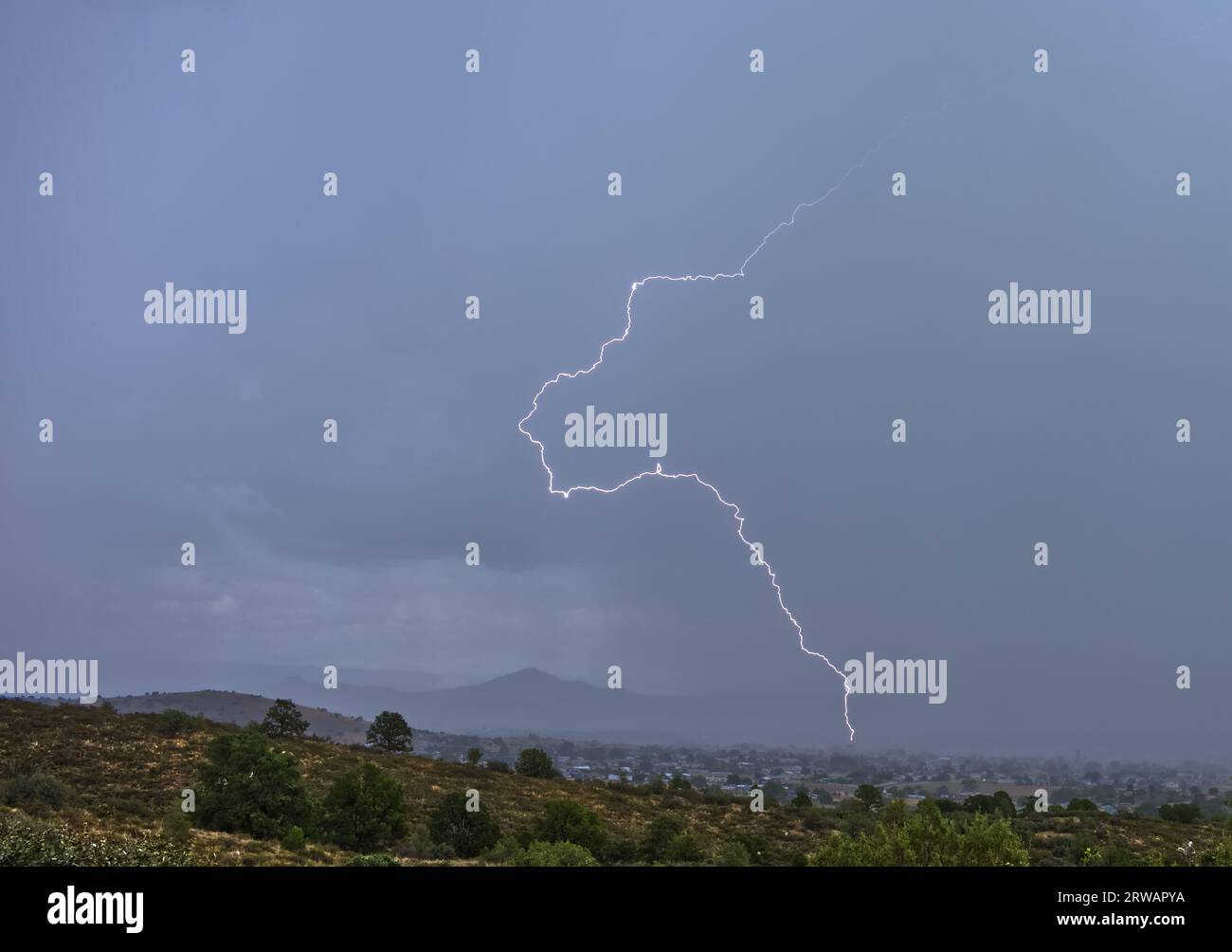 Lightning striking during the monsoon,  Sullivan Butte, Chino Valley, Arizona, USA Stock Photo