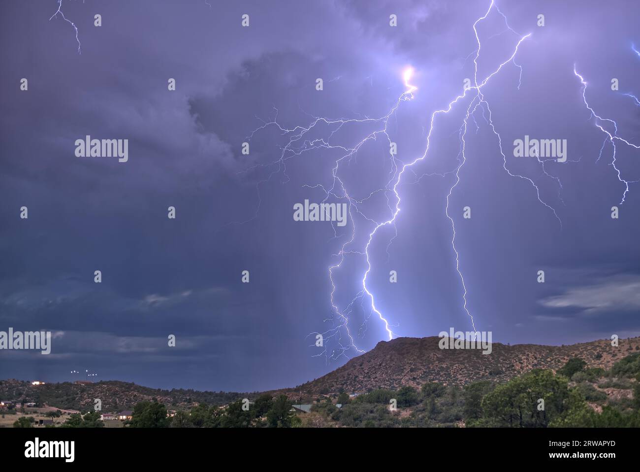 Lightning striking Sullivan Butte in Chino Valley Arizona during the 2023 Monsoon season. Stock Photo
