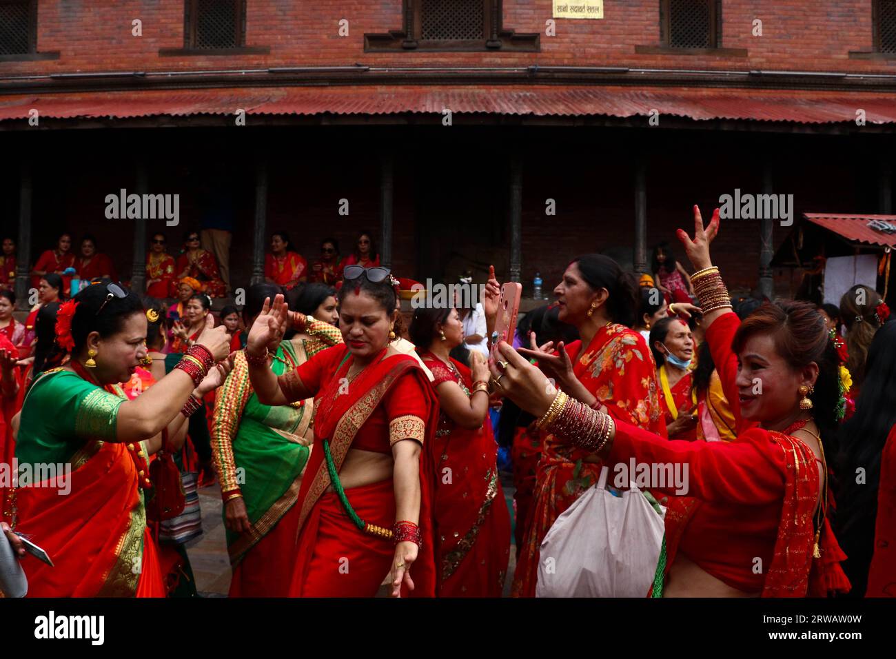 Kathmandu, Nepal. 18th Sep, 2023. On September 18, 2023, in Kathmandu, Nepal. Women chant songs and dance at the premises of Pashupati Nath Temple during the 'Teej' festival. This festival commemorates the union of Lord Shiva and Parvati and involves fasting, cultural feasts, and religious rituals. Hindu women fast for the well-being of their family members and for their own souls. (Photo by Abhishek Maharjan/Sipa USA) Credit: Sipa USA/Alamy Live News Stock Photo