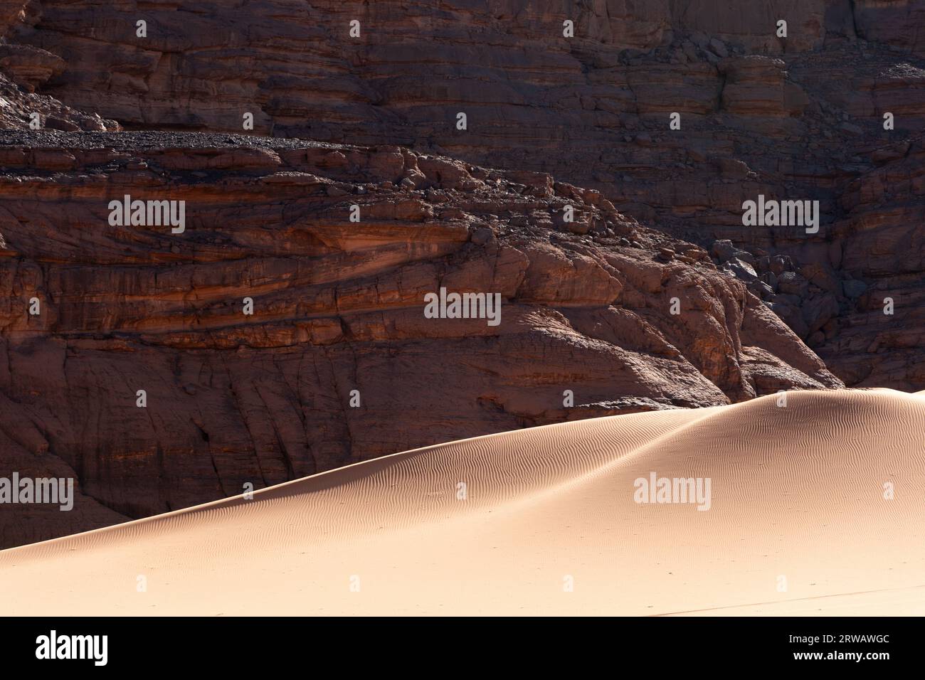Rock and dune in Algeria Stock Photo
