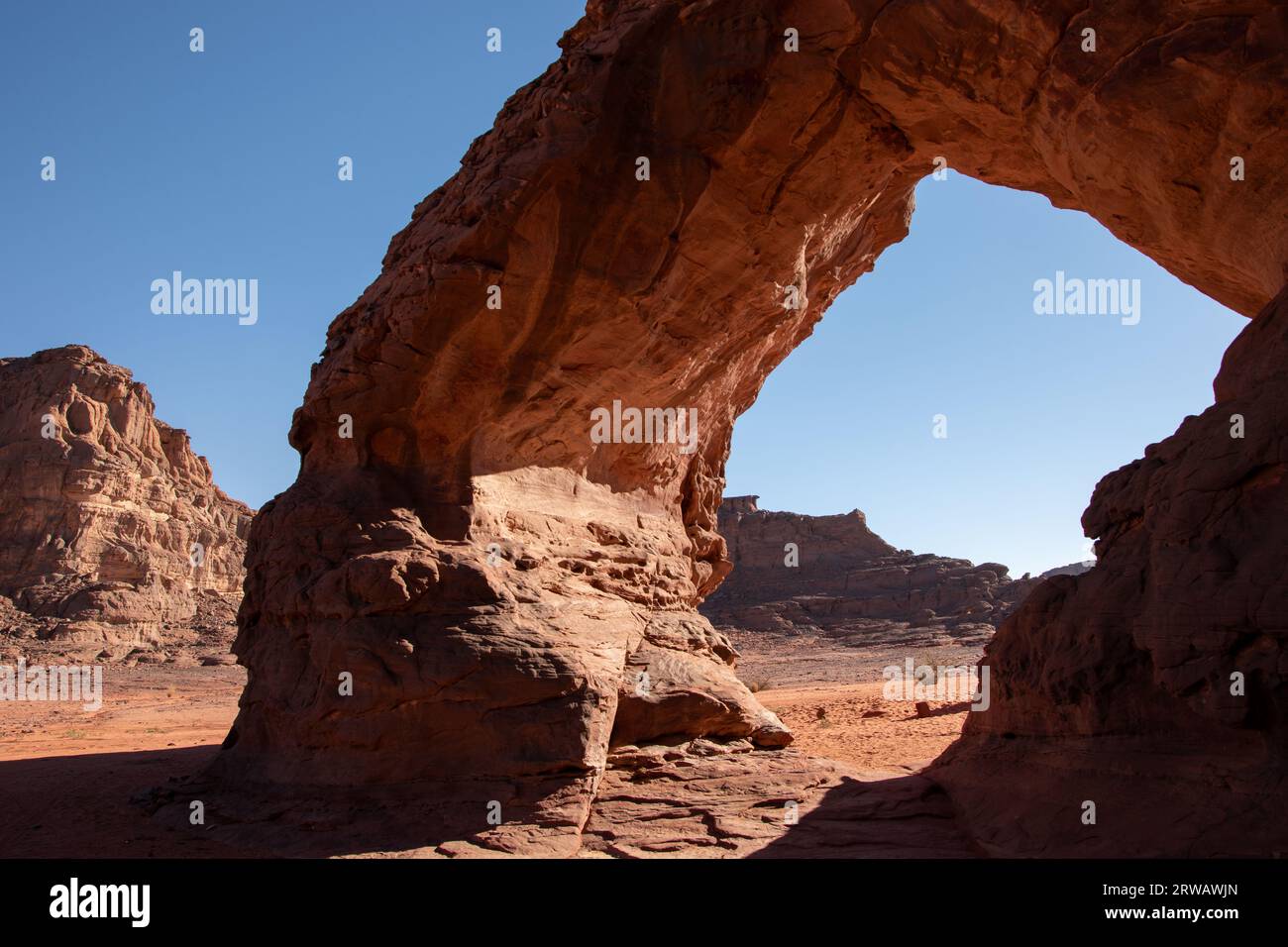A natural arch in the sahara desert Stock Photo