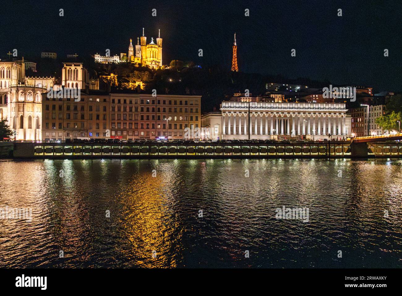 Night view across the River Saone towards Lyon Old Town and the 2 Cathedrals, St Jean Baptiste and Basilica Saint Jean Baptiste. Stock Photo