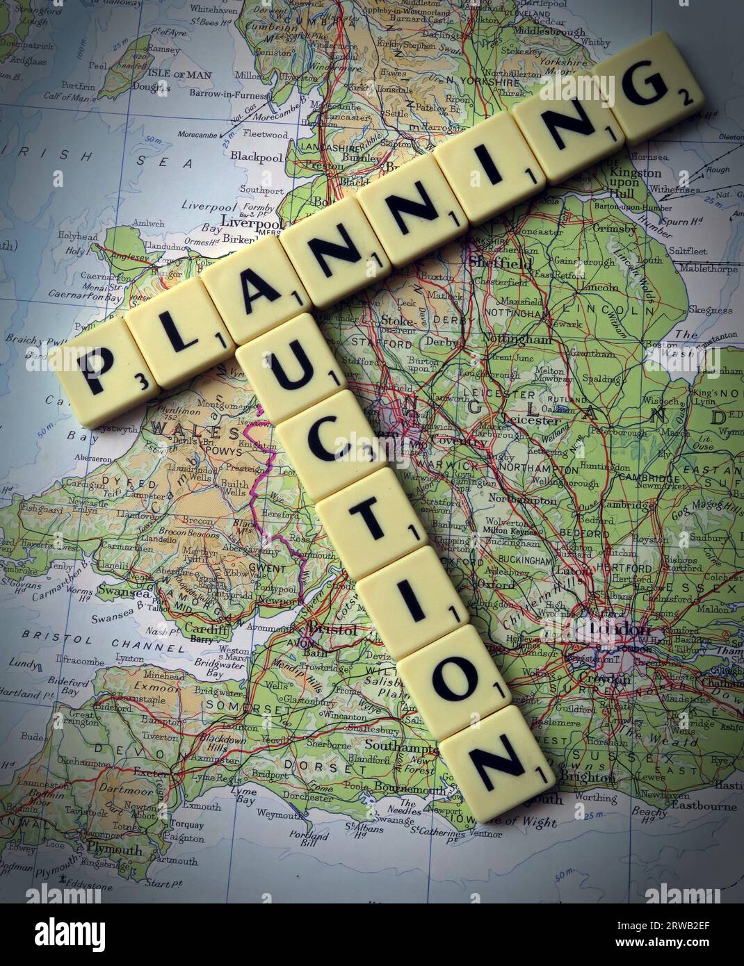 Planning Auction in Scrabble letters on a map of Great Britain, Stock Photo