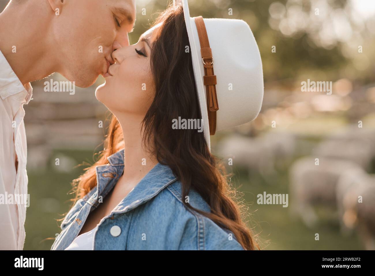 Happy man hugs his pregnant woman's belly at sunset Stock Photo - Alamy