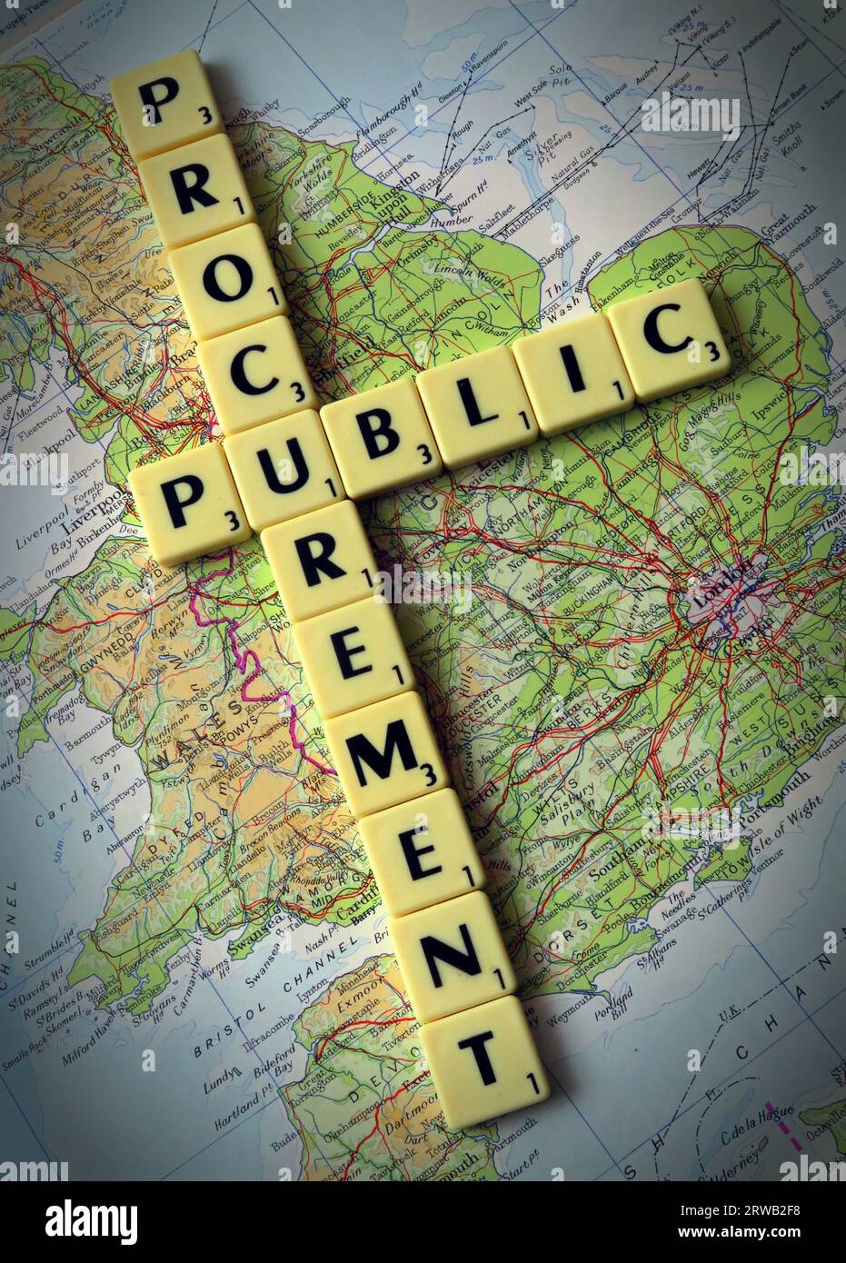 Public procurement in Scrabble letters on a map of Great Britain, Stock Photo