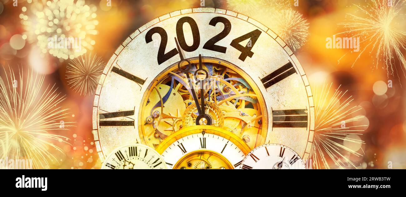 2024 New Year with clock counting down to midnight with defocused