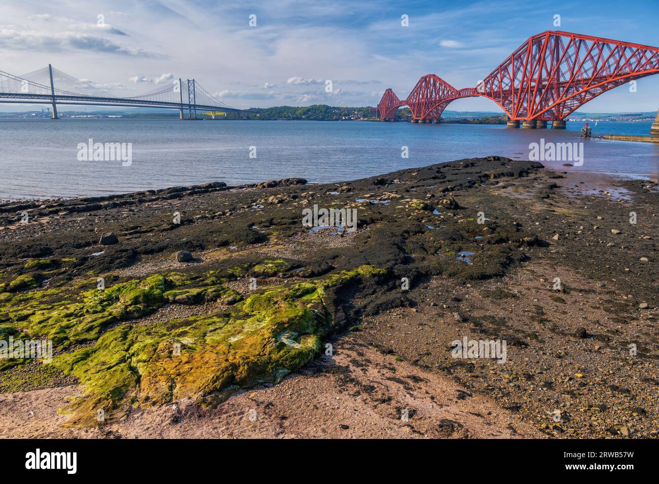 Firth of Forth estuary with Forth Bridge and Forth Road Bridge from the shore in South Queensferry, Scotland, UK. Stock Photo