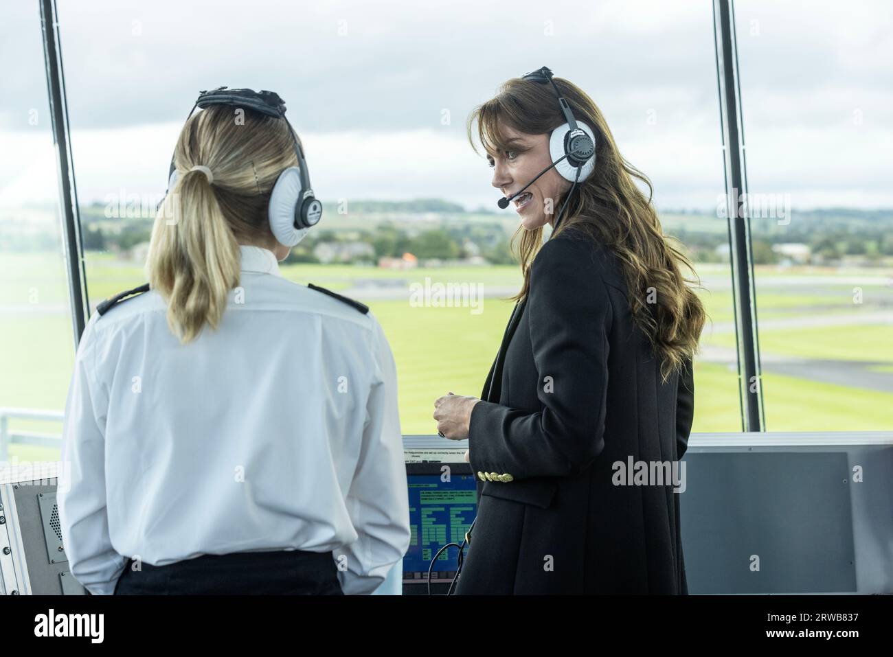 The Princess of Wales wears headphones as she talks to the crew of a Royal Navy wildcat helicopter from the control tower during a visit to the Royal Naval Air Station (RNAS) Yeovilton, near Yeovil in Somerset, one of the Royal Navy's two principal air stations and one of the busiest military airfields in the UK. Picture date: Monday September 18, 2023. Stock Photo