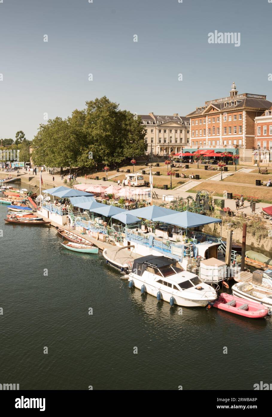 Peggy Jean Barge and exclusive riverside property on the River Thames at Richmond Upon Thames, London, England, U.K. Stock Photo