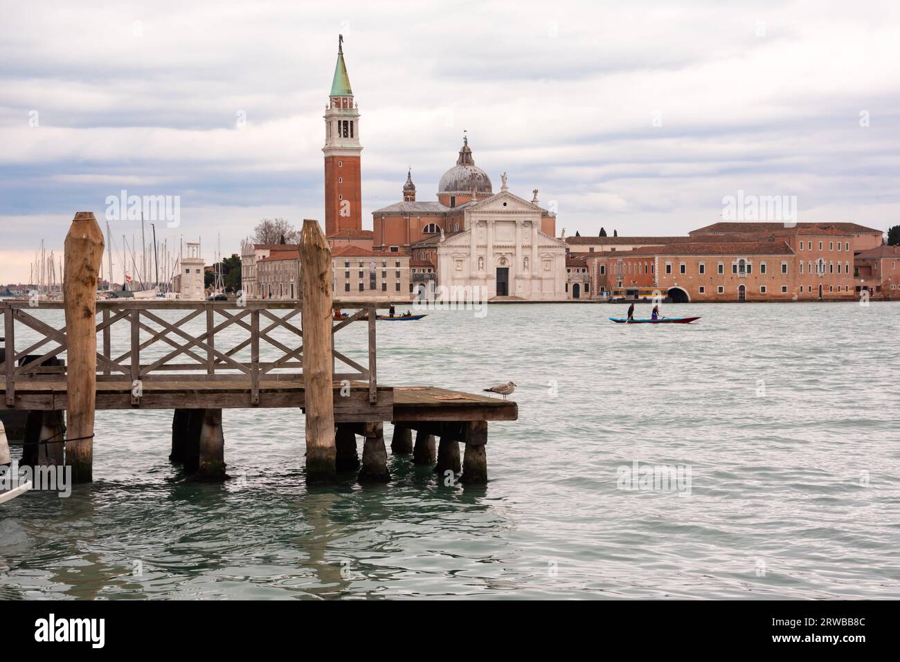 Venice city in Italy seen from wooden pier Stock Photo - Alamy