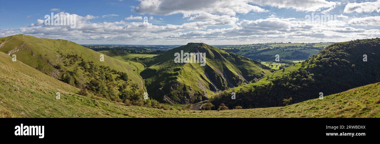 Panoramic view of Dovedale looking towards Thorpe Cloud and the stepping stones over the River Dove, Peak District National Park, Derbyshire, England Stock Photo