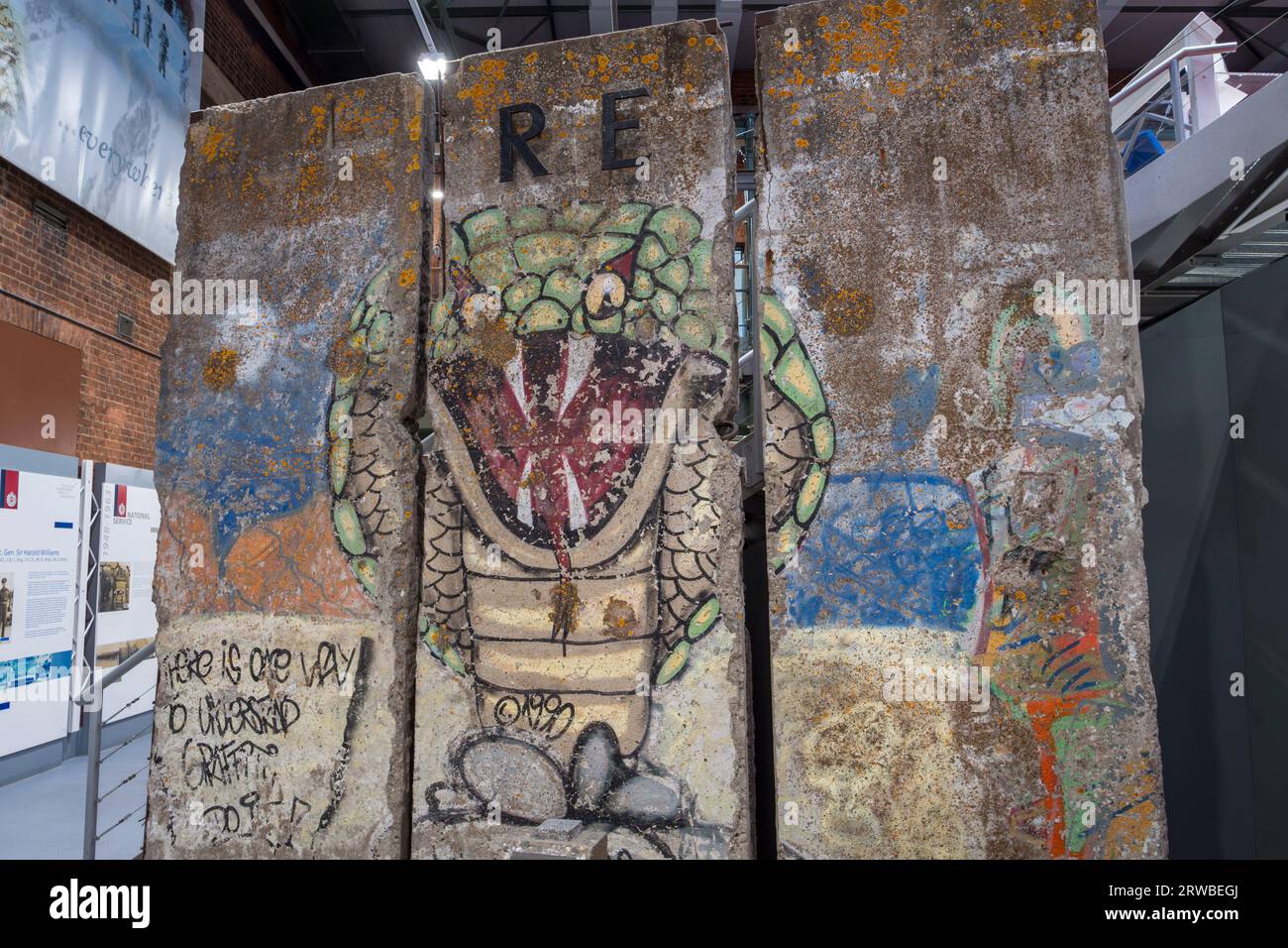 Three graffitied sections of the Berlin Wall on display in the Royal Engineers Museum in Gillingham, Kent, UK. Stock Photo