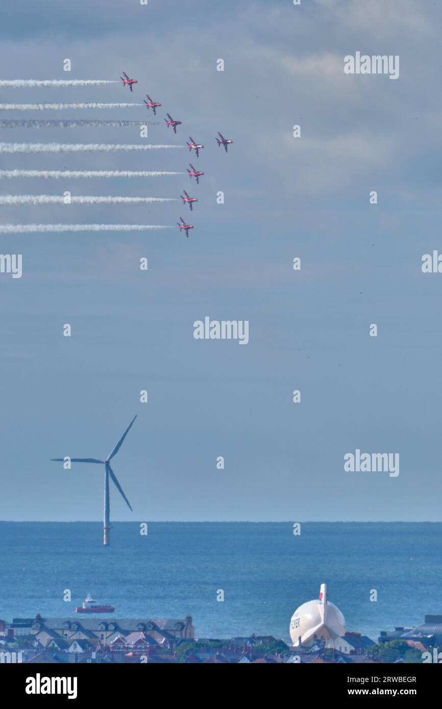 The Red Arrows in formation performing at the Rhyl Air Show 2023 above the Zip World Skyflyer Stock Photo