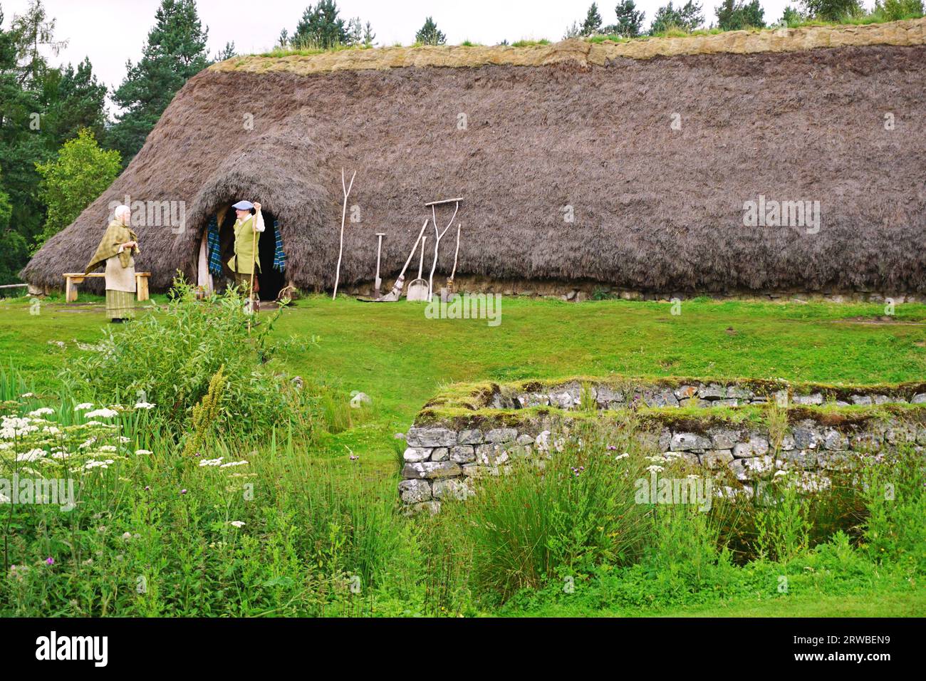 Reconstruction of a large 1700s thatched roof house at the Highland Folk Museum, an open air museum sharing the history of the Scottish Highlands Stock Photo