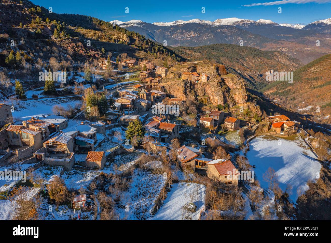 Aerial view of the snowy town of Querforadat in winter, on the northern slope of Cadí (Alt Urgell, Lleida, Catalonia, Spain, Pyrenees) Stock Photo