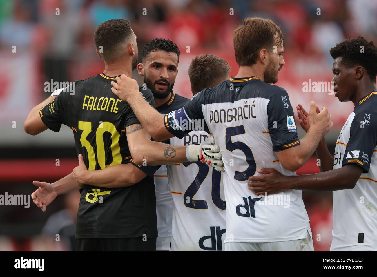 Monza, Italy. 17th Sep, 2023. Wladimiro Falcone of US Lecce is congratulated on his performance by team mates Ahmed Touba, Ylber Ramadani, Marin Pongracic and Lameck Banda following the final whistle of the Serie A match at U-Power Stadium, Monza. Picture credit should read: Jonathan Moscrop/Sportimage Credit: Sportimage Ltd/Alamy Live News Stock Photo