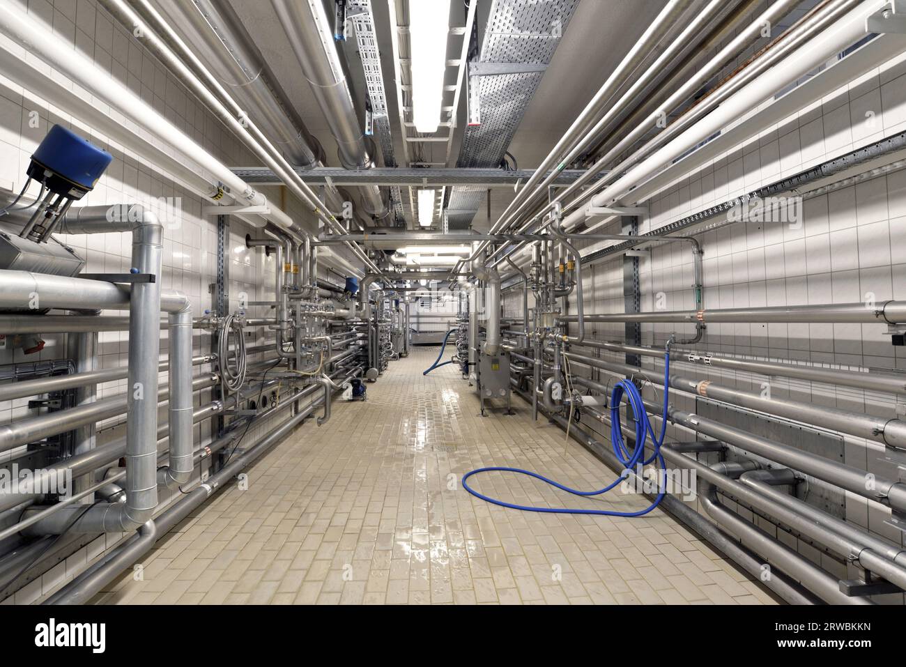 Industrial plant in a modern brewery - technology in a factory building with pipes and fittings Stock Photo