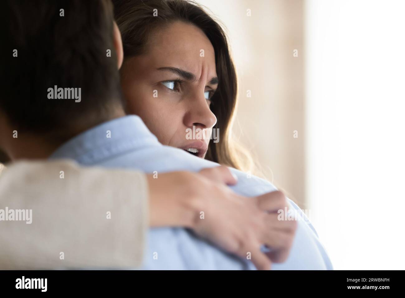 Frustrated woman hugging man hi-res stock photography and images - Alamy