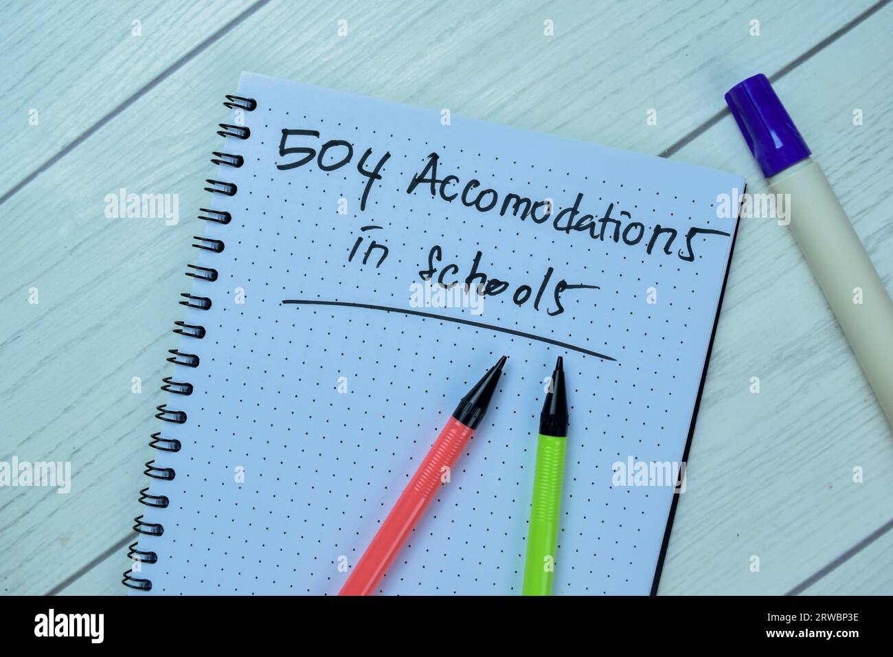 Concept of 504 Accomodations in Schools write on book isolated on Wooden Table. Stock Photo