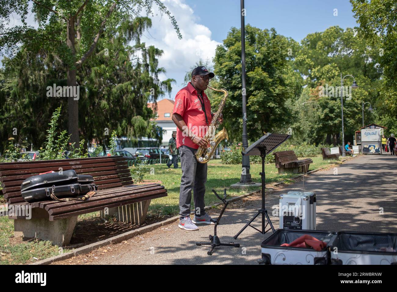 Belgrade, Serbia, Jul 21, 2021: Portrait of a jazz musician playing saxophone at the Danube River promenade in Zemun Stock Photo