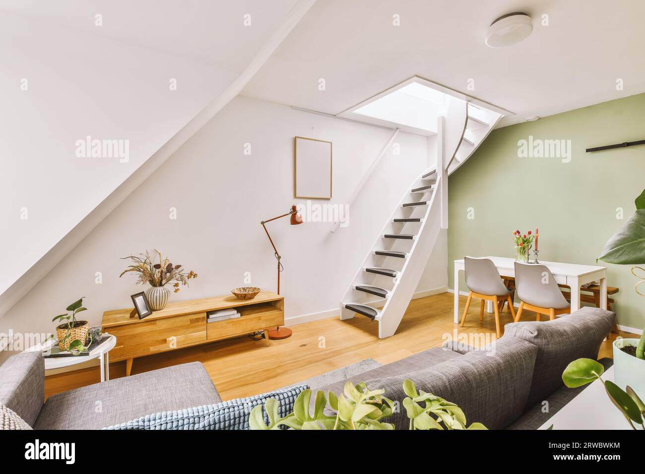 Interior of living room with stairs leading to upper floor and