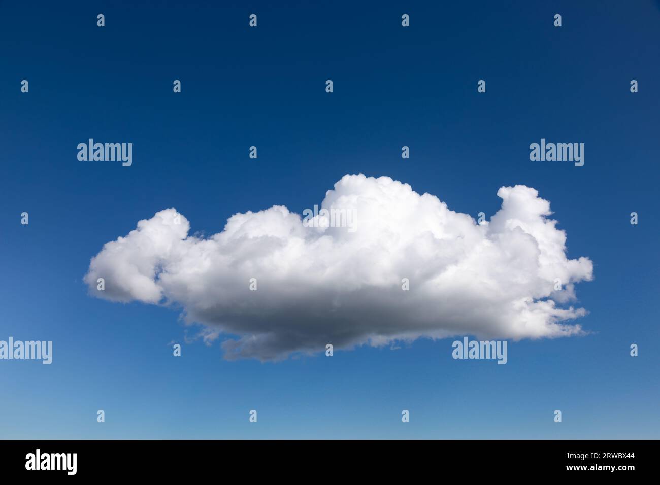 Blue summer sky with single cumulus cloud natural background with copy space Stock Photo