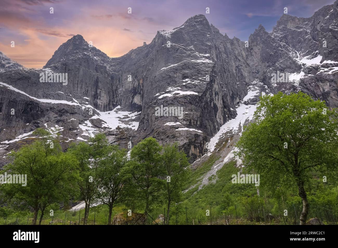 The Troll Wall (English) or Trollveggen (Norwegian) is part of the mountain massif Trolltindene (Troll Peaks) in the Romsdalen valley in Rauma Municip Stock Photo