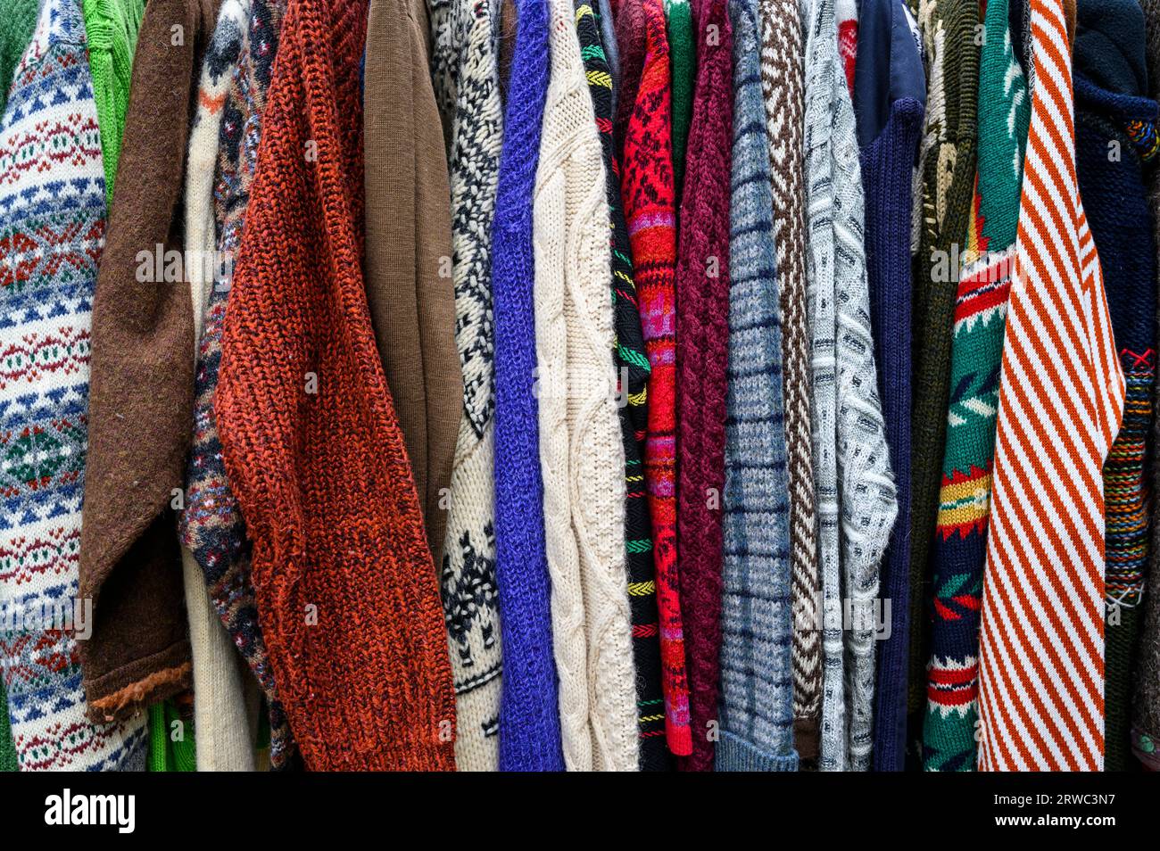 Sweaters for sale in a thrift shop Stock Photo