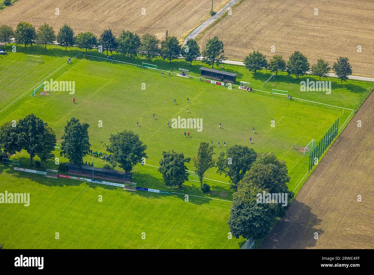 Aerial view, soccer players on the sports field SV Bausenhagen and Baumallee, Bausenhagen, Fröndenberg, Ruhr area, North Rhine-Westphalia, Germany, Tr Stock Photo