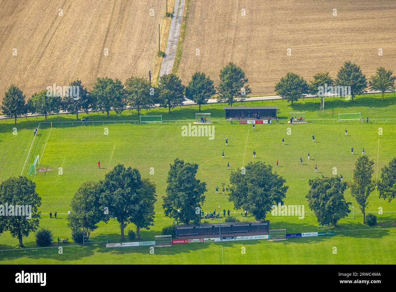 Aerial view, soccer players on the sports field SV Bausenhagen and Baumallee, Bausenhagen, Fröndenberg, Ruhr area, North Rhine-Westphalia, Germany, Tr Stock Photo