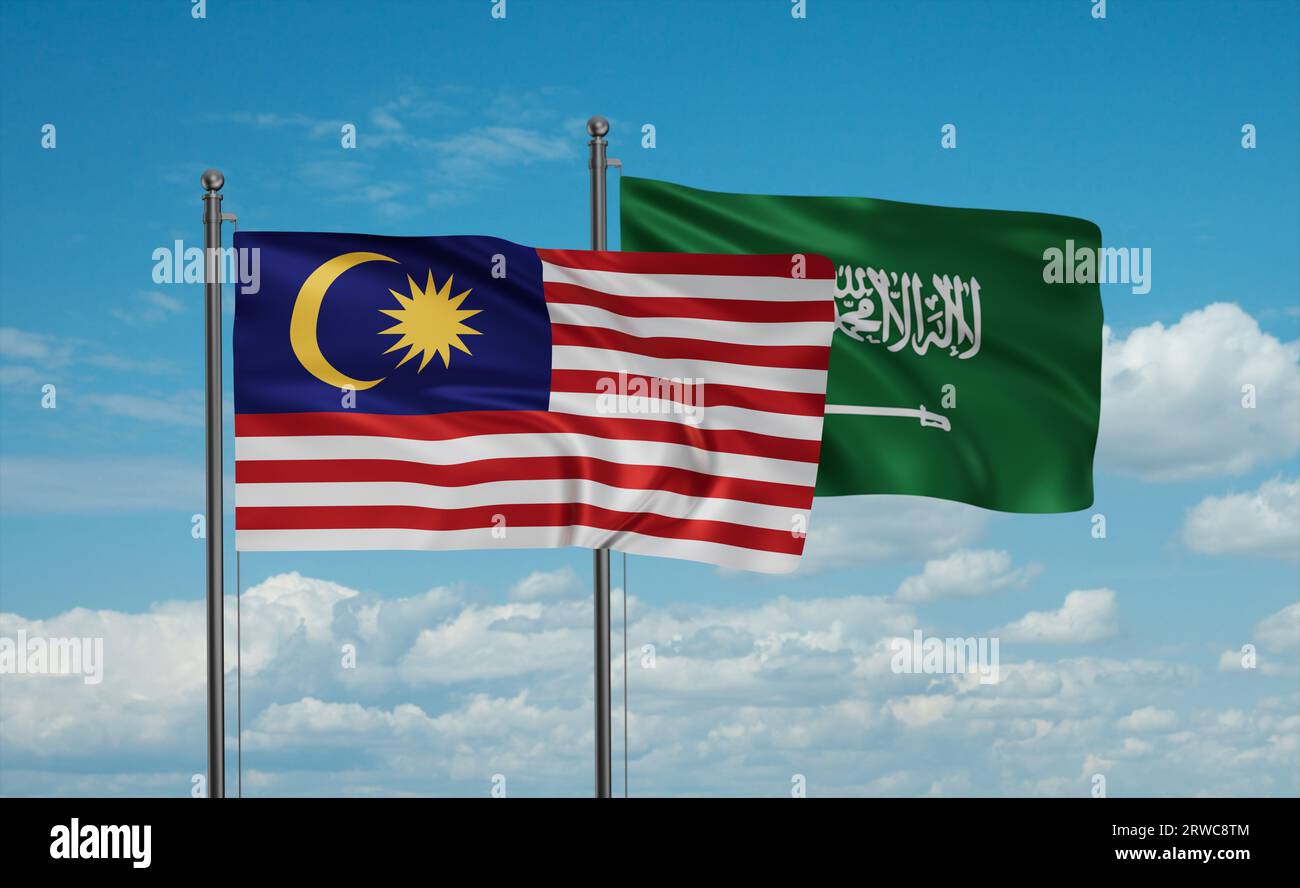 Malaysia and Saudi Arabia flags waving together in the wind on blue sky Stock Photo