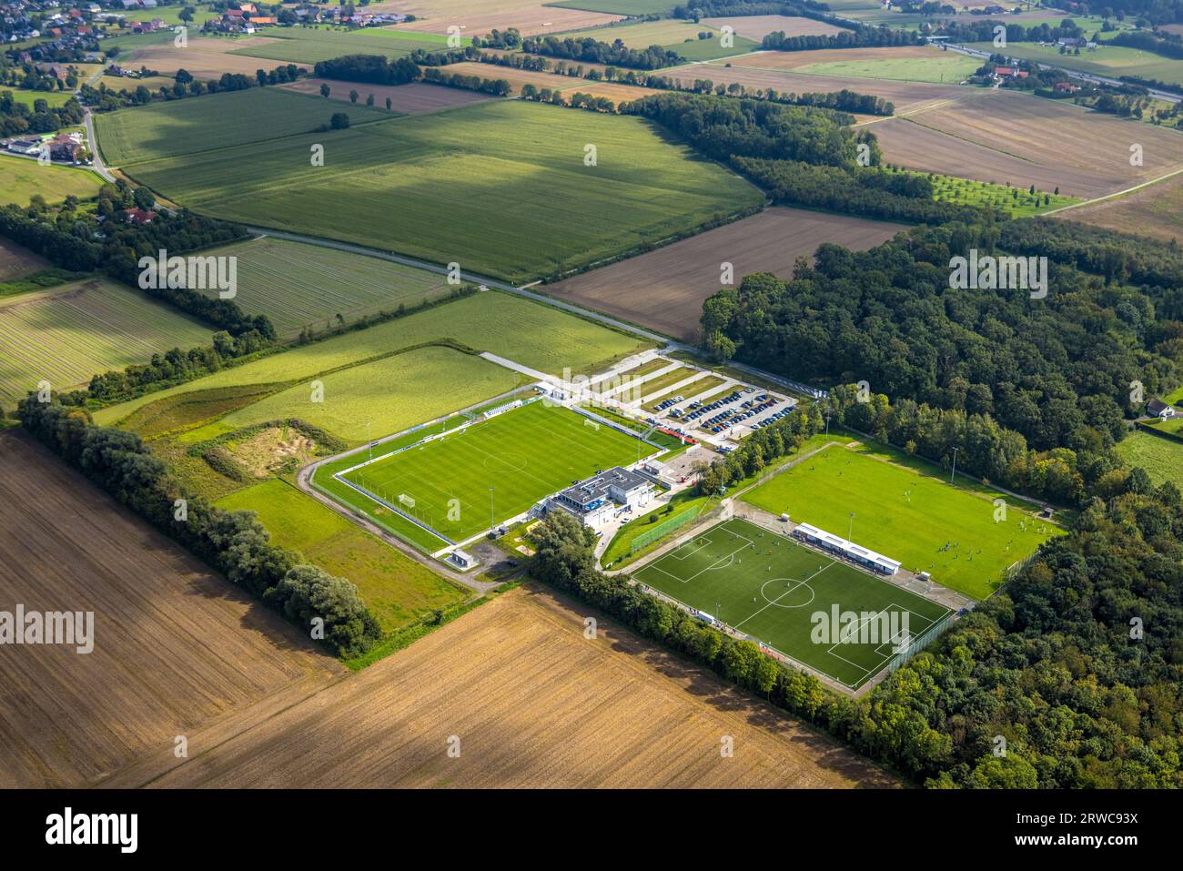 Aerial view, new construction sports field with stands as well as club building with sports day care center, An der Lohschule, Rhynern, Hamm, Ruhrgebi Stock Photo