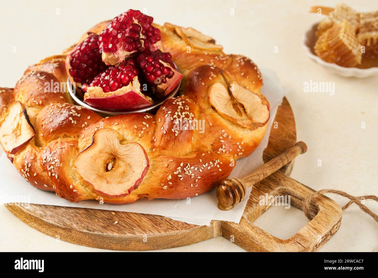 Jewish Holidays - Rosh Hashanah or Rosh Hashana. Pomegranate, apples, honey and round challah on rustic grey table background. Jewish Autumn celebrati Stock Photo