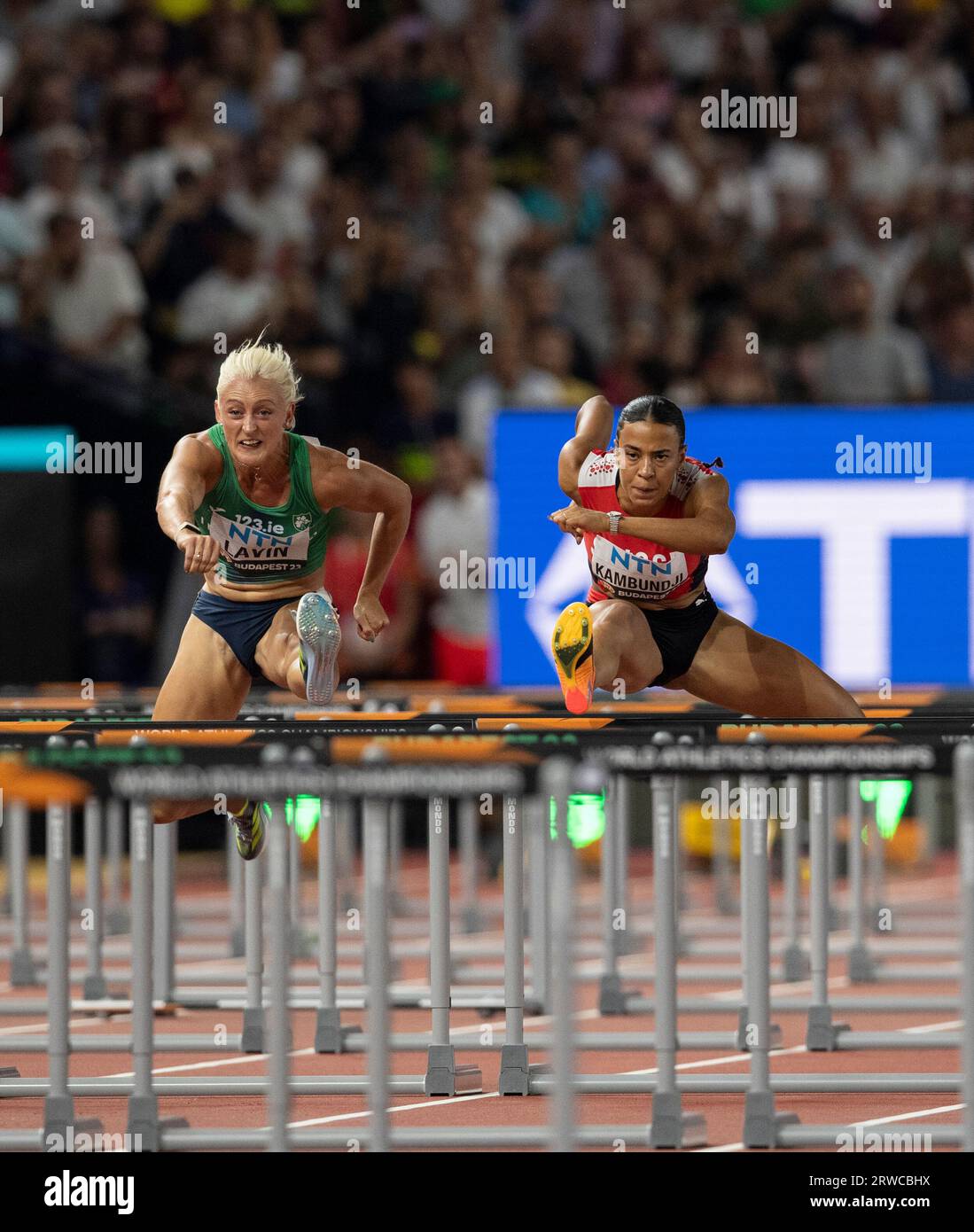 Sarah Lavin of Ireland and Ditaji Kambundji of Switzerland competing in the 100m women hurdles semi final on day five at the World Athletics Champions Stock Photo