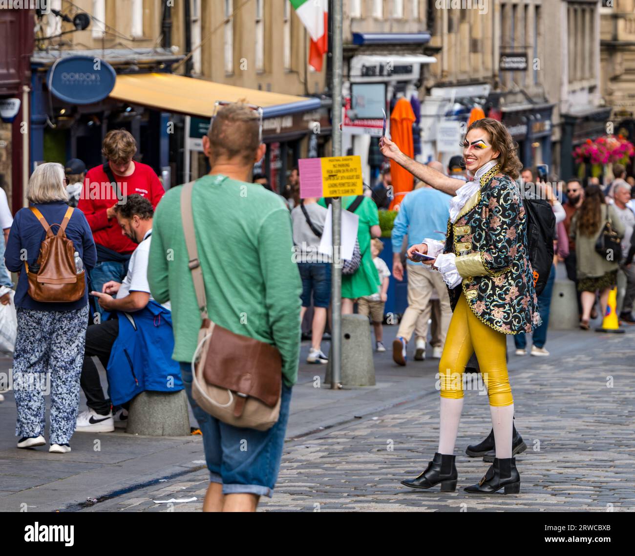 Edinburgh Festival Fringe male performer dressed in period costume handing out flyers, Royal Mile, Scotland, UK Stock Photo