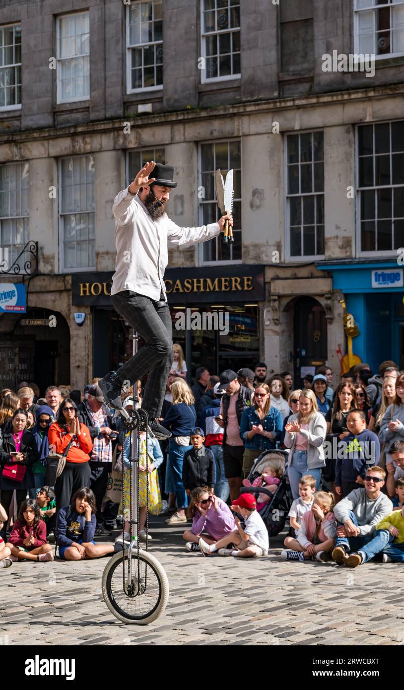 Street performer on unicycle, Edinburgh Festival Fringe, Royal Mile, Scotland, UK Stock Photo
