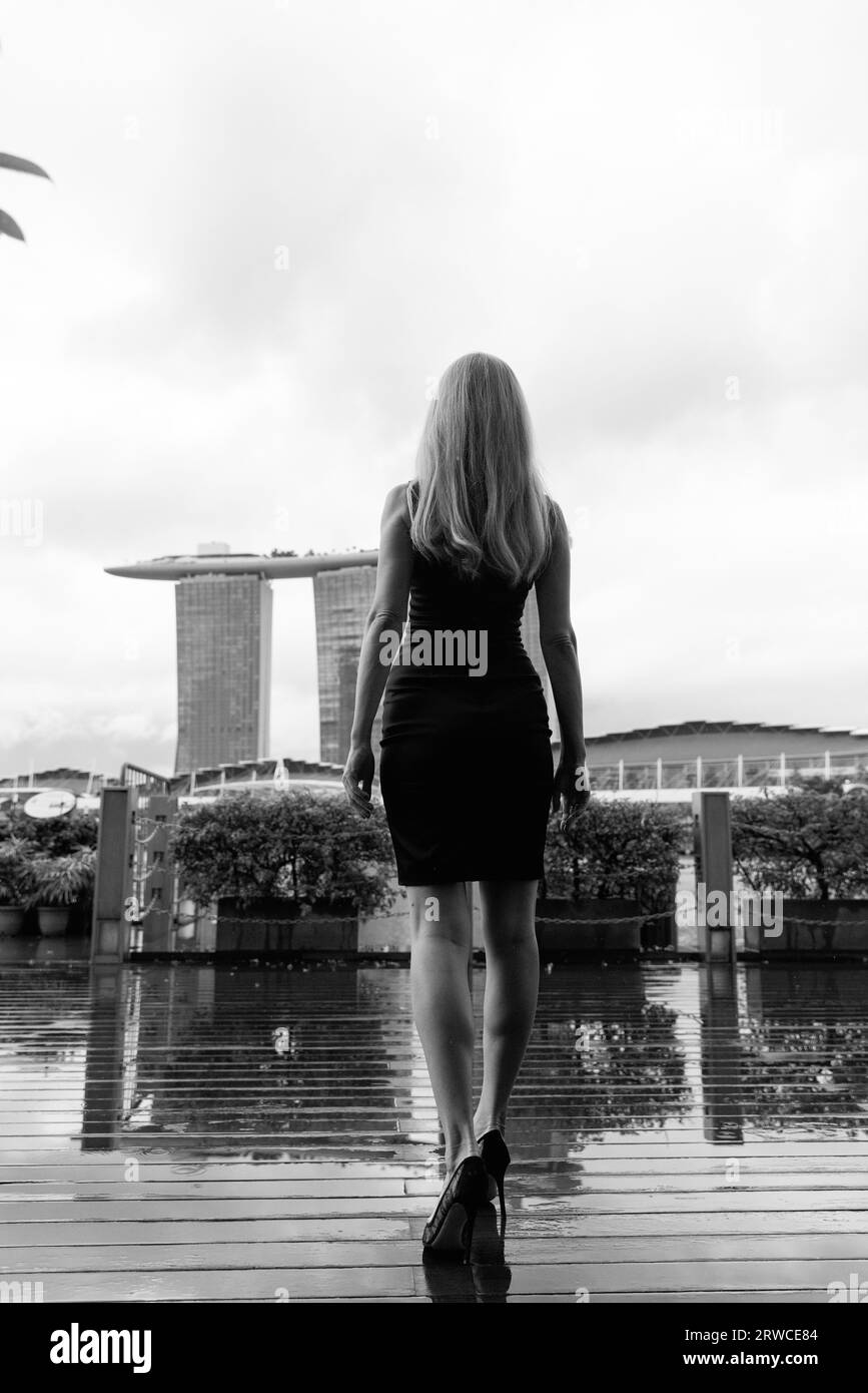 Young female model is posing in front of legendary Marina Bay Sands in