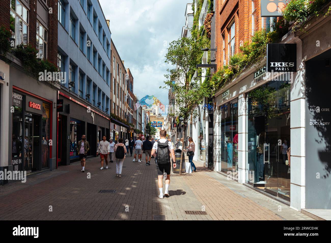 London, UK - August 27, 2023: View of Carnaby Street. It is a pedestrianised shopping street in Soho in the City of Westminster Stock Photo
