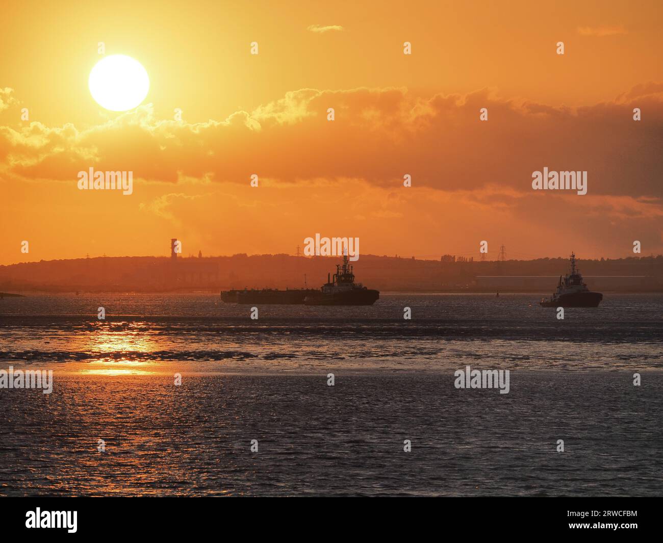 Queenborough, Kent, UK. 18th Sep, 2023. UK Weather: two tugs at sunset in Queenborough, Kent. Credit: James Bell/Alamy Live News Stock Photo