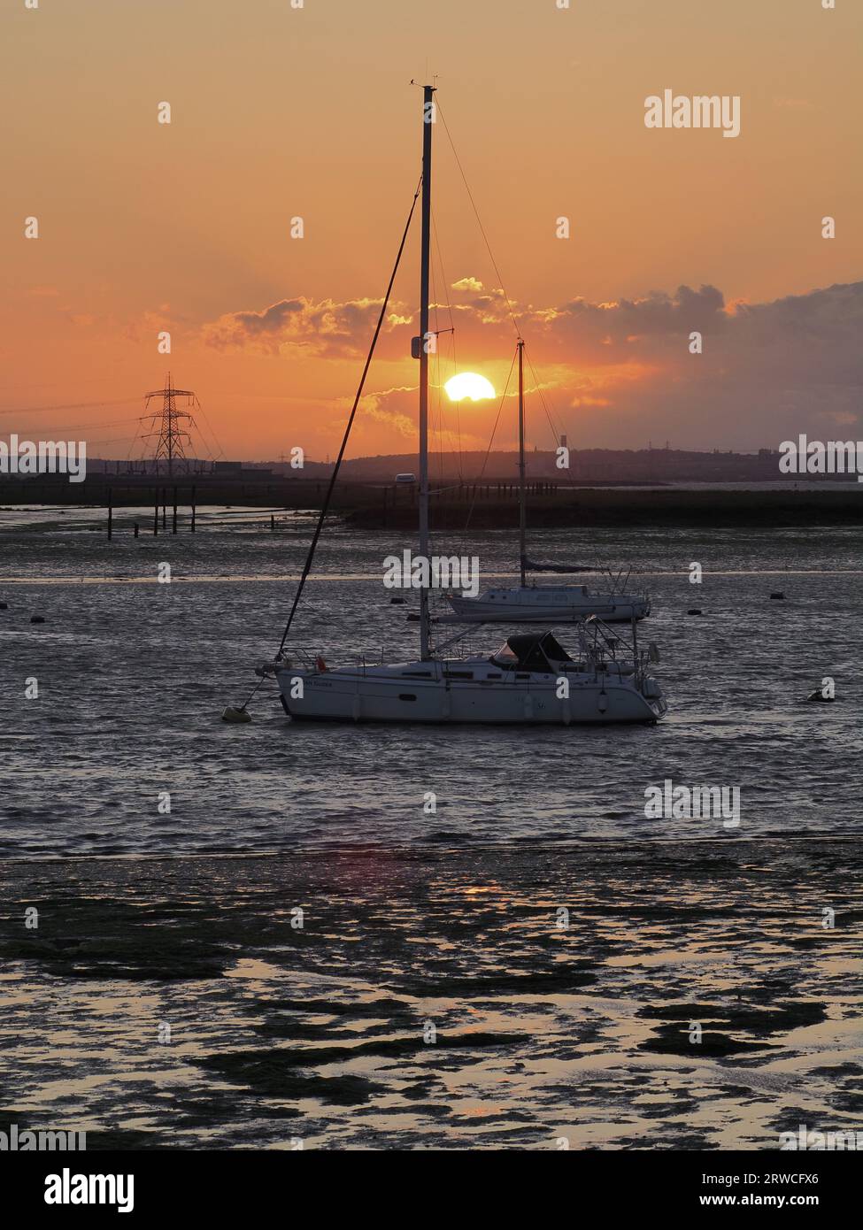 Queenborough, Kent, UK. 18th Sep, 2023. UK Weather: yachts at sunset in Queenborough harbour, Kent. Credit: James Bell/Alamy Live News Stock Photo